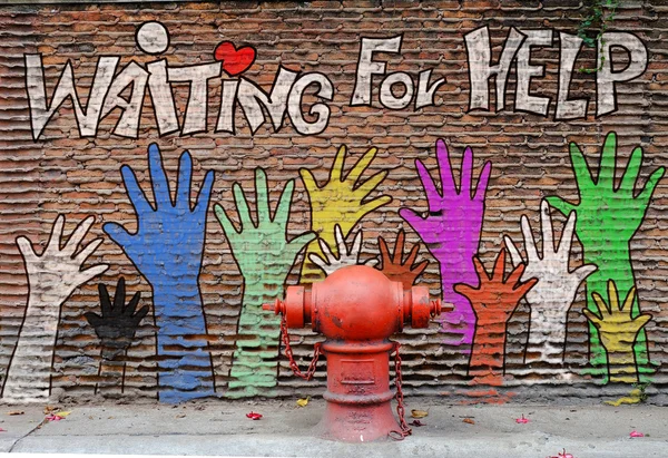 Helping hand paint on the wall — Stock Photo, Image