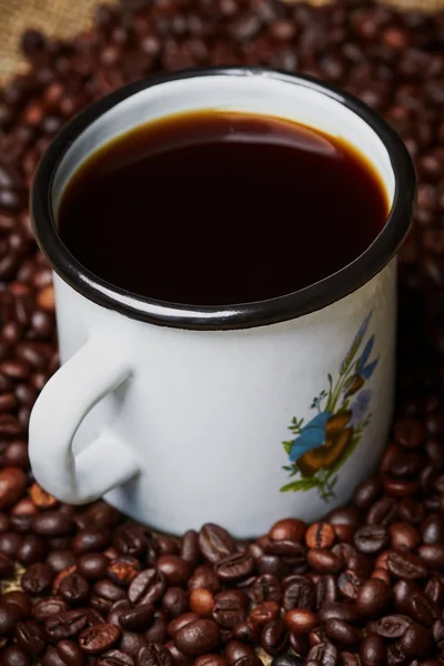 Metal mug on grains — Stock Photo, Image