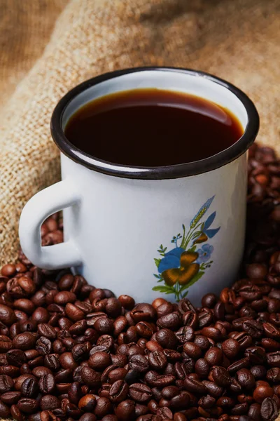 Metal mug on grains — Stock Photo, Image