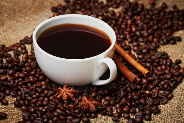 Porcelain mug on grains — Stock Photo, Image