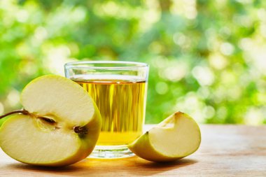 Apple lobule and glass on the table