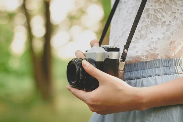 Retro camera in hand — Stock Photo, Image