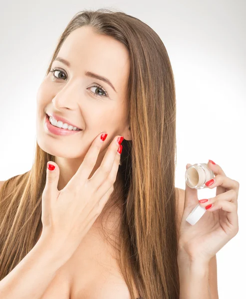 Woman applying  face cream — Stock Photo, Image