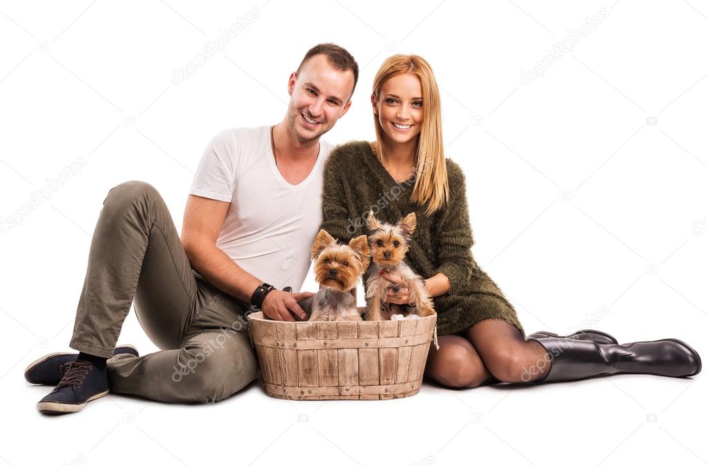 Man and woman with  yorkshire terriers