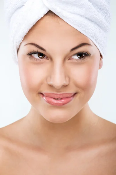 Woman in towel on her head — Stock Photo, Image