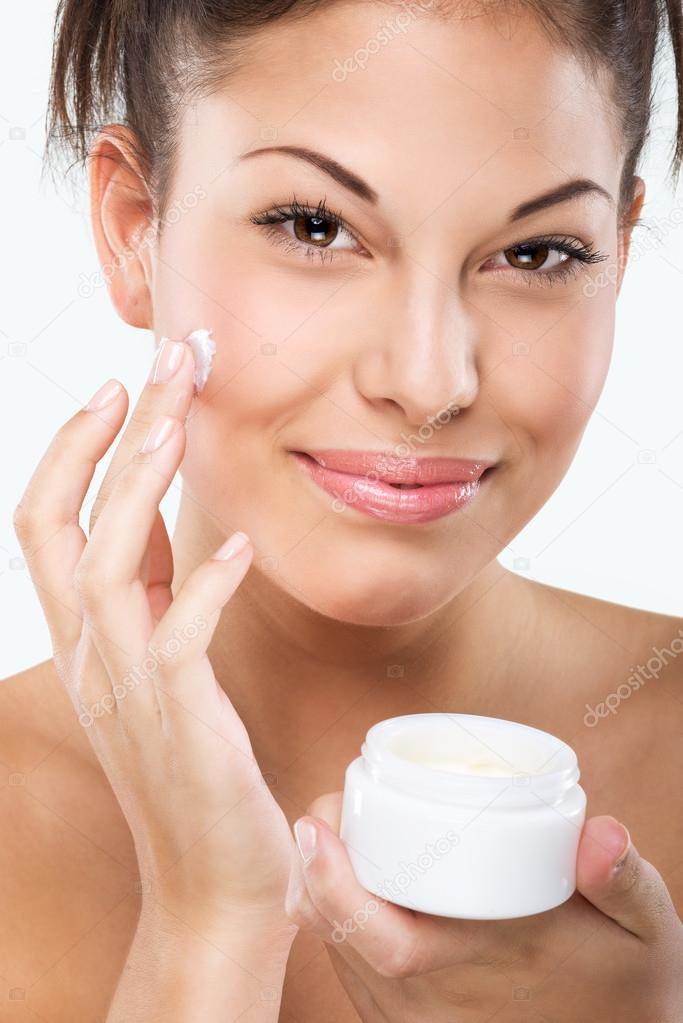 Woman with moisturizing face cream