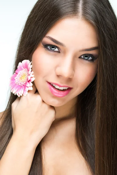 Woman with flower in hand — Stock Photo, Image