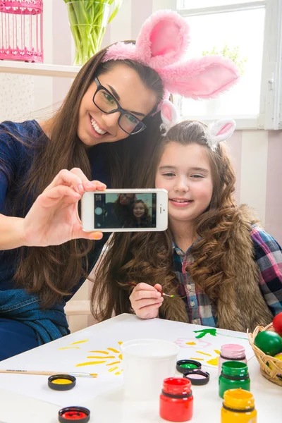 Mother and daughter with bunny ears — Stock Photo, Image