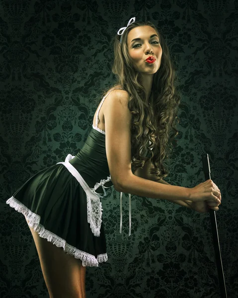 Woman maid holding a broom — Stock Photo, Image