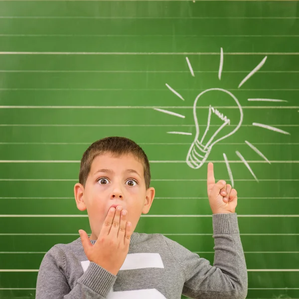 Boy showing light bulb — Stock Photo, Image