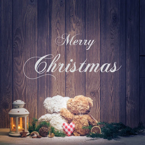 Merry Christmas subtitles and embracing bears — Stock Photo, Image