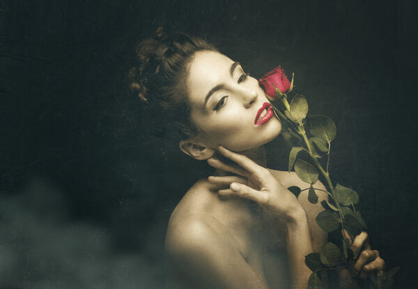 Vintage woman with red rose