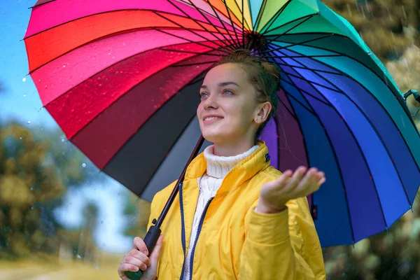 Happy Woman Yellow Jacket Multi Colored Rainbow Umbrella Rain Rainy — Stock Photo, Image