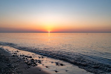 Texture of calm sea and sunset
