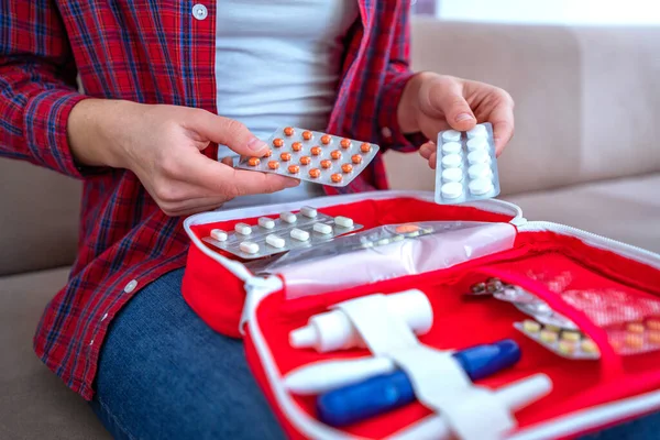 Medical first aid kit with medicine and pills for pain and illness