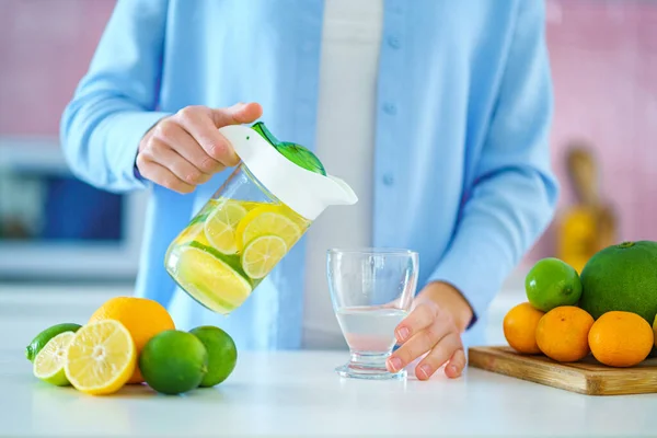 Woman Pouring Refreshing Infused Detoxification Citrus Water Jug Glass Vitamin — Foto de Stock