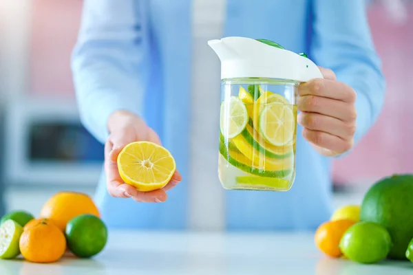 Woman Holds Glass Jug Refreshing Infused Detoxification Citrus Water Vitamin — Foto de Stock
