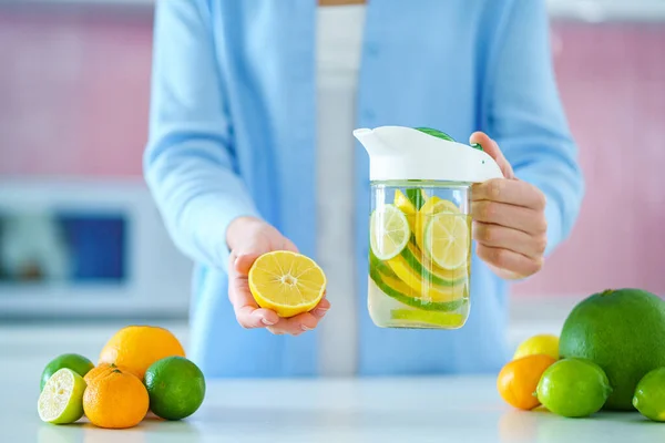 Woman Holds Glass Jug Refreshing Infused Detoxification Citrus Water Vitamin — Foto de Stock