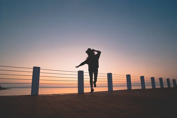 Silhouette Free Carefree Dancing Woman Hat Sea Pier Sunset Happy — Stock Photo, Image