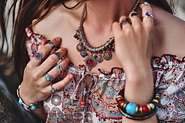 Stylish boho chic woman. Fashionable indian hippie gypsy bohemian outfit with jewelry accessories details 