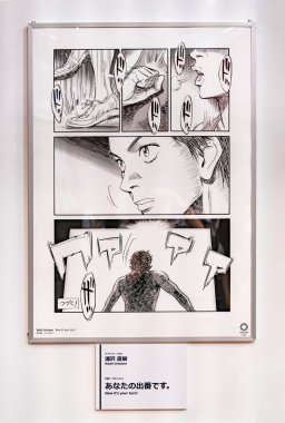 tokyo, japan - august 24 2021: Poster featuring a comic strip of paralympic sport discipline by japanese manga artist Naoki Urasawa at Sports Olympic Square in Yurakucho. clipart