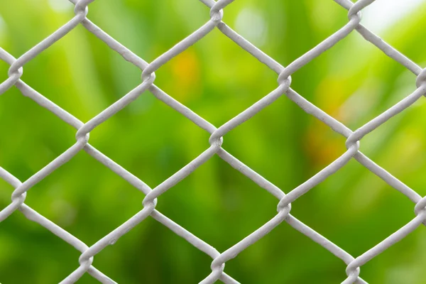 Mesh fence closeup on blur backgroun — Stock Photo, Image