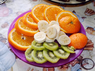 Plate with many sliced fruits