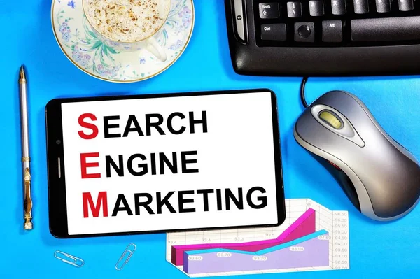 Search engine marketing. Text message on the smartphone screen. Search engine optimization, web content updates and promotion, site promotion.