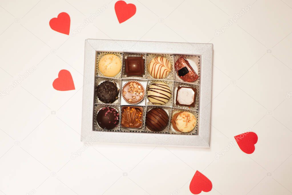 Chocolate candies in box flat lay. Valentine's day gift. 