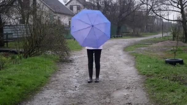 Woman Raincoat Rotating Umbrella Outdoor Rainy Weather Having Fun — Stock Video