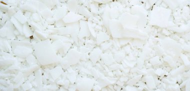 Üst manzara soya balmumu dokusu. Beyaz pullar. Mum yapımı. Organik kozmetik malzemeleri.