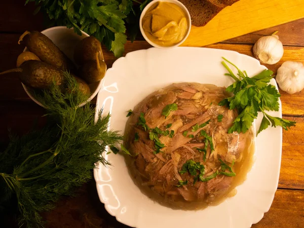 Traditional Russian meat aspic with mustard. Jellied meat.