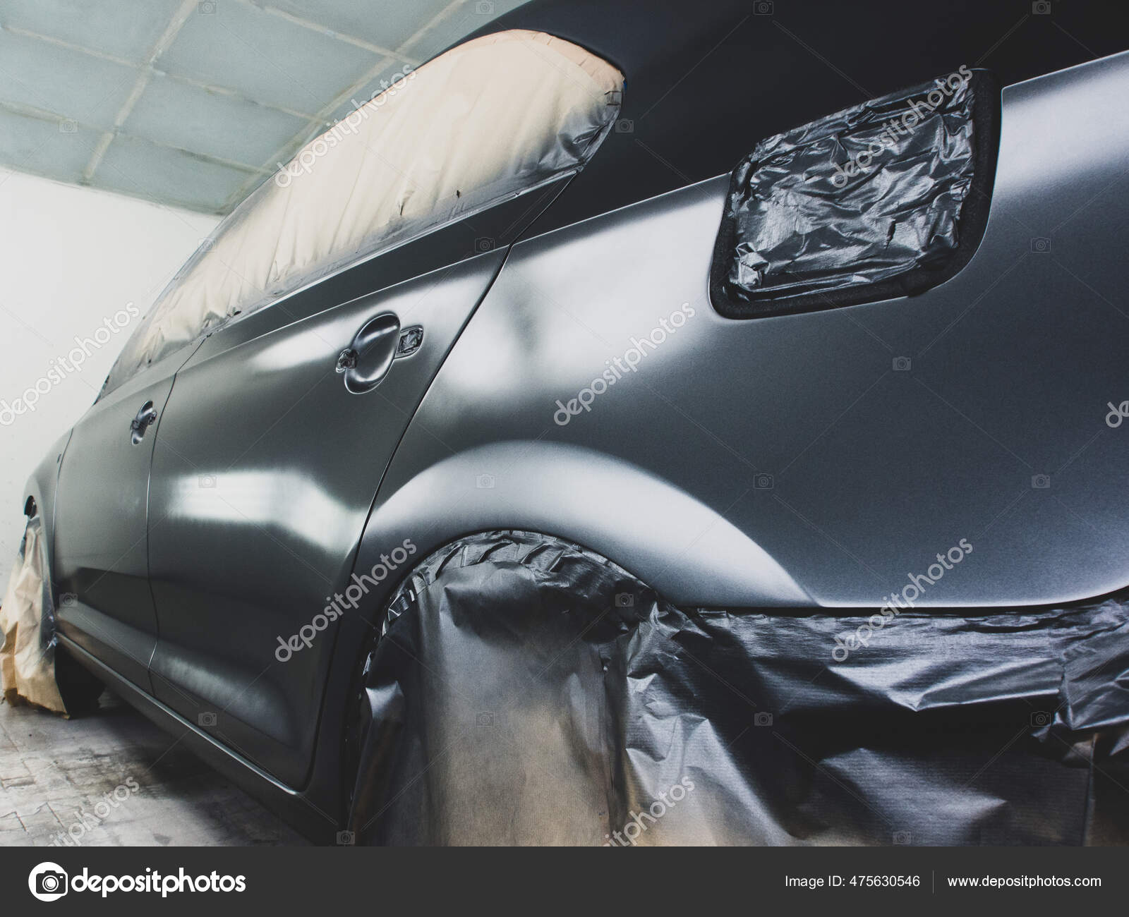 Stage of application of car paint.Car repair technology Stock Photo by