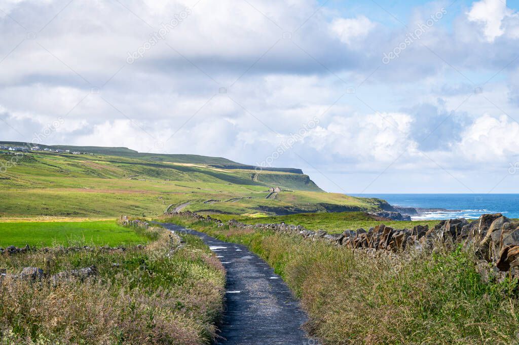 Old coastal road that leads to the Cliffs of Moher on the west coast of Ireland