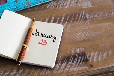 23 Ocak takvim günü defter üzerinde el yazısı