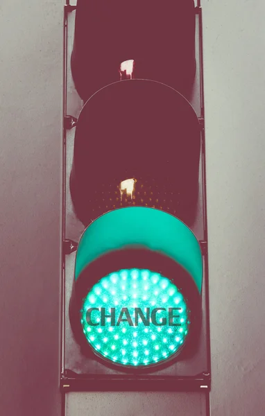 Close up on green traffic light message CHANGE — Stock Photo, Image