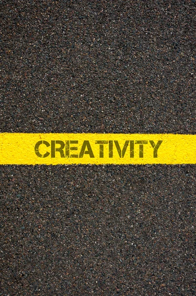 Road marking yellow line with word CREATIVITY — Stock Photo, Image