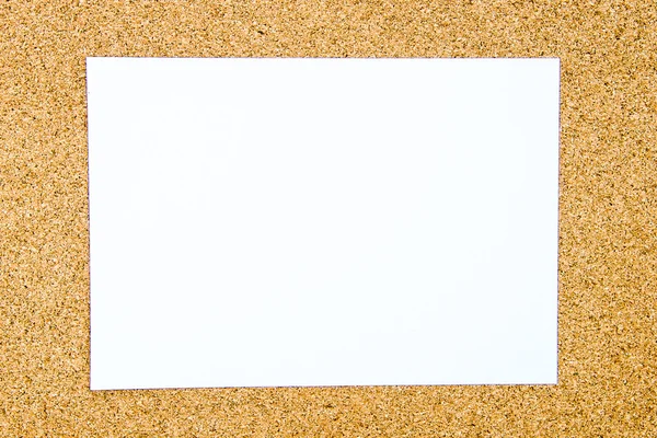 Blank white paper note over cork board background — Stock Photo, Image