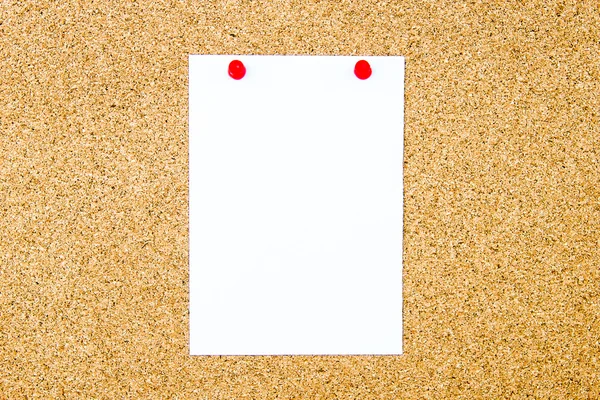 Blank white paper note pinned on cork board — Stock Photo, Image