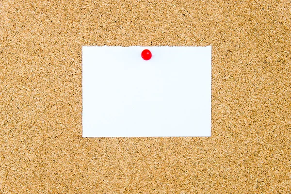 Blank white paper note pinned on cork board — Stock Photo, Image