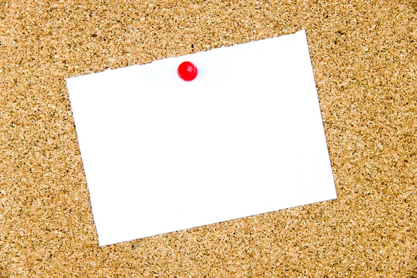 Blank white paper note pinned on cork board — Stock Photo, Image
