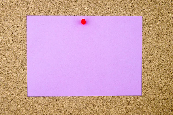 Blank violet paper note pinned on cork board — Stock Photo, Image