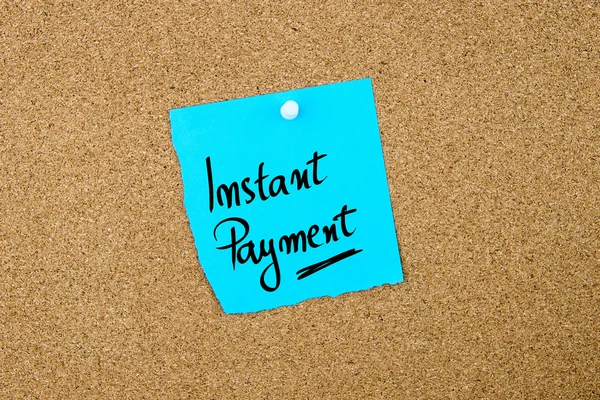 Instant Payment written on blue paper note