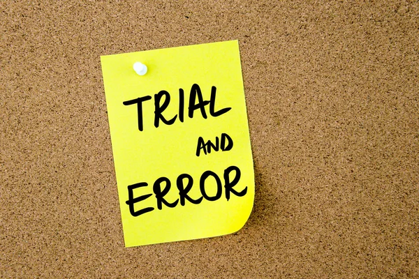 TRIAL and ERROR written on yellow paper note — Stock Photo, Image