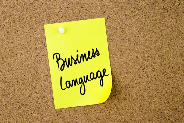 Geschäftssprache auf gelbem Zettel geschrieben — Stockfoto