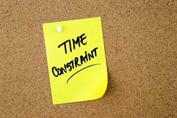 TIME CONSTRAINT written on yellow paper note — Stock Photo, Image