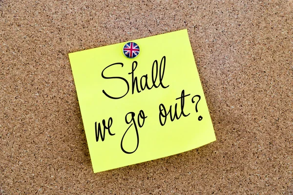 Yellow paper note pinned with Great Britain flag thumbtack and text Shall We Go Out ? — Stockfoto