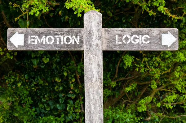 EMOTION versus LOGIC directional signs — Stock Photo, Image