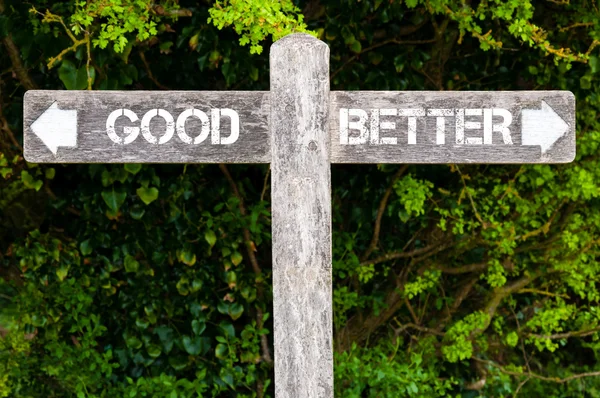 GOOD versus BETTER directional signs — Stock Photo, Image