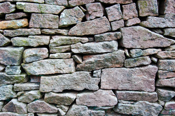 Primer plano en una pared de piedra seca en la campiña de yorkshire, Reino Unido. Patrón materiales de construcción —  Fotos de Stock